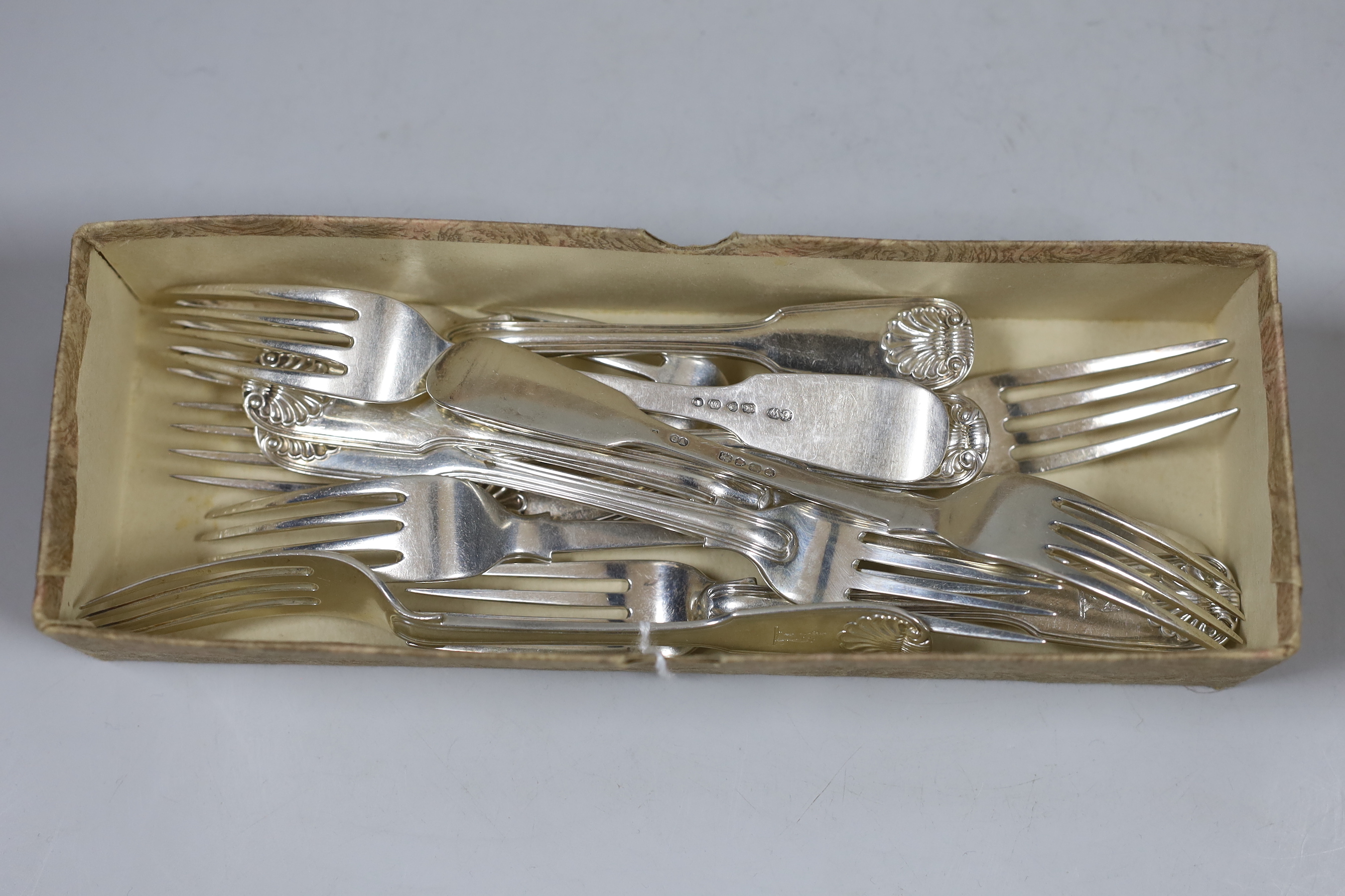 A harlequin set of eleven George III and later fiddle, thread and shell pattern dessert forks, various dates and makers, 18.8oz.